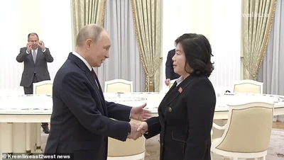 Vladimir Putin greets North Korean foreign minister Choe Son Hui at the Kremlin