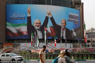 Banner of Iranian President Masoud Pezeshkian's photo taken with Hamas Political Bureau Head Ismail Haniyeh at the inauguration ceremony, hung at Veliasr Street on Tehran, Iran