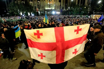 Demonstrators attend an opposition protest against the results of the parliamentary election in Tbilisi,