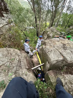 A woman was struck head-first for seven hours between two boulders in Australia