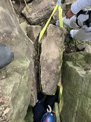 A woman was rescued after being wedged upside down between boulders for 7 hours, in Australia.