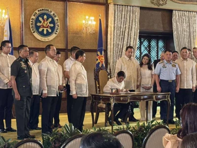 President Ferdinand Marcos Jr. signs into law the Philippine Maritime Zones Act and the Philippine Archipelagic Sea Lanes Act in a ceremony in Malacañang on Nov. 8, 2024. PHOTO COURTESY OF MPC POOL