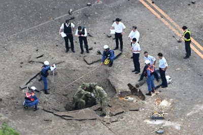 Bomb crater on Miyazaki Airport taxiway Japan