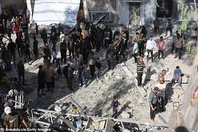 Residents and civil defense team conduct search and rescue operations after the Israeli army targeted Asma School, run by the UN agency for Palestinian refugees (UNRWA) in the Shati refugee camp in Gaza Strip on October 27, 2024