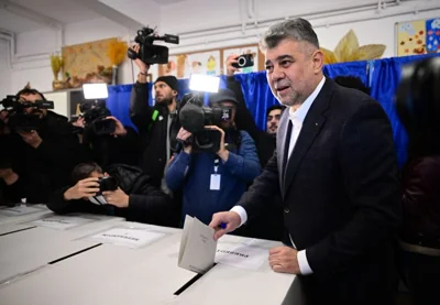 Social-democrat Prime Minister Marcel Ciolacu casts ballot in Romanian Presidential election November 24, 2024 [Daniel Mihailescu / AFP]