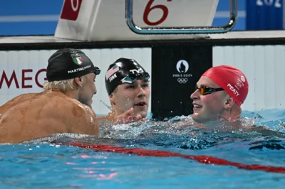 Three swimmers after race.