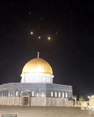 Israel's military chief has vowed a response to the Iranian aerial salvo (pictured over Jerusalem), which was mostly intercepted, while world leaders have urged de-escalation