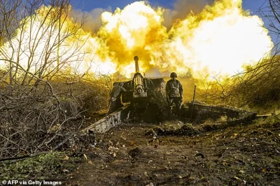 A Ukrainian soldier fires towards Russian positions outside Bakhmut