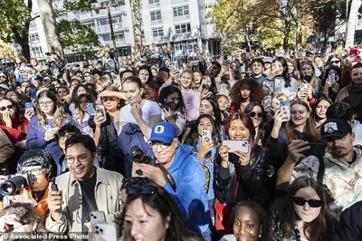 Crowds look on at the Timothee Chalamet lookalike contest near Washington Square Park, Sunday, Oct. 27, 2024, in New York