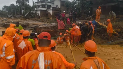 Landslides caused by heavy rains kill 49 and bury many others in southern India