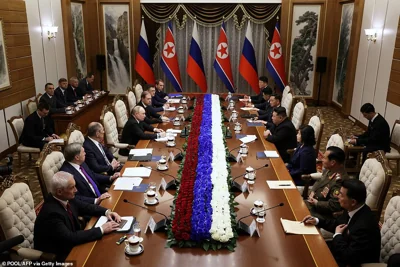 North Korea's leader Kim Jong Un (center-R) listens to Russian President Vladimir Putin (center-L) during their meeting in Pyongyang on June 19, 2024.