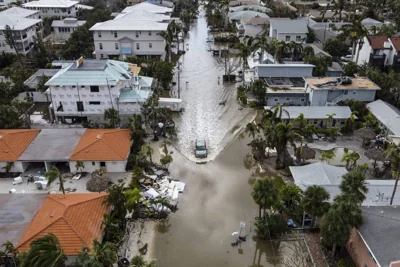 In this aerial photo, a vehicle drives though a flooded street after Hurricane Milton, in Siesta Key, Florida, on October 10, 2024. AFP PHOTO