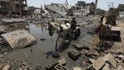 Donkey and trailer trudge through the devastated Gaza Strip amid hopes of a ceasefire
