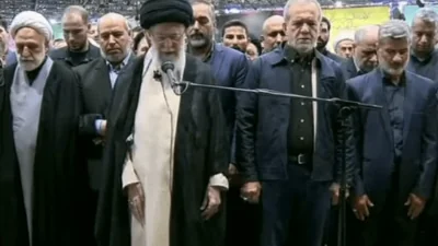 Khamenei leading the funeral prayers [Screengrab/Al Jazeera]