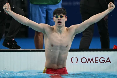 China's Pan Zhanle reacts after winning gold