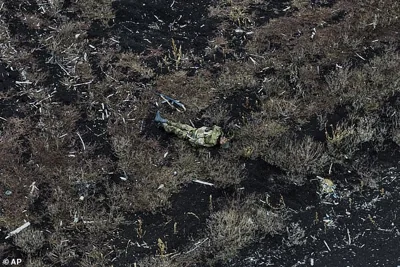 The body of a dead Russian soldier lies on the ground at the frontline between Russian and Ukrainian positions near Klishchiivka, Donetsk Region