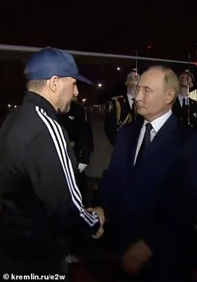 FSB assassin Vadim Krasikov, sentenced to life in prison in Germany in 2021, is greeted by president Vladimir Putin upon his arrival in Russia yesteday