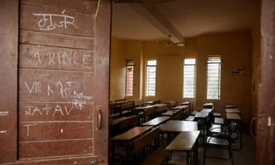 Rows of desks in an empty classroom