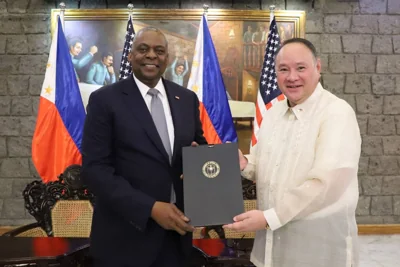 This handout taken and released on November 18, 2024 by the Department of National Defense shows US Secretary of Defense Lloyd Austin (left) and Philippine Defense Secretary Gilberto Teodoro posing after signing the General Security of Military Information Agreement (GSOMIA) at Camp Aguinaldo in Quezon City, Metro Manila. AFP PHOTO / DEPARTMENT OF NATIONAL DEFENSE