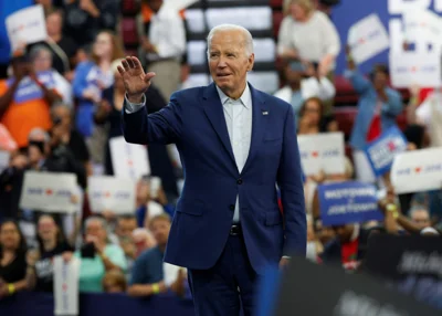 Democratic calls mount for Biden to end campaign, but he vows to fight on