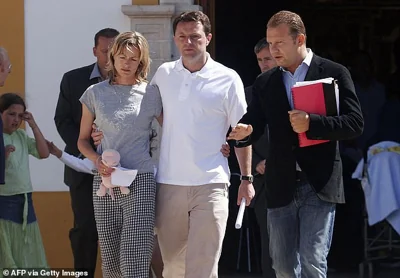 Kate and Gerry McCann, the parents of missing 3-year-old girl Madeleine McCann, stop to talk to the press after attending a church service in Praia da Luz