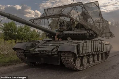 Ukrainian troops drive a Soviet-made T-64 tank in the Sumy region, near the border with Russia, last month