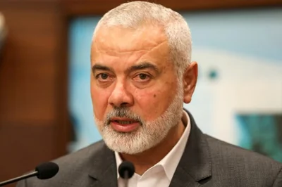 Palestinian group Hamas' top leader Ismail Haniyeh talks after meeting with Lebanon's President Michel Aoun