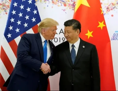 Donald Trump shakes hands with Chinaâs Xi Jinping back in June 2019