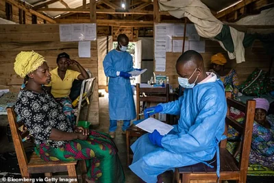 Pictured above is a doctor speaking to a patient about treating monkeypox in the South Kivu region in September this year