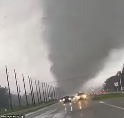 A tornado rips through Florida powerlines as Hurricane Milton lands at a category 3 storm