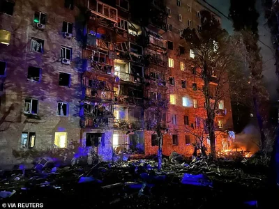 A view shows an apartment building that was damaged, according to local authorities, by debris from a downed Ukraine-launched missile, in Kursk, Russia, in this handout picture released August 11, 2024