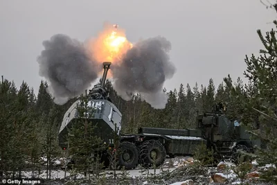 A Swedish artillery team fires a projectile from an Archer self-propelled Howitzer during the NATO "Exercise Lightning Strike" on November 20, 2024