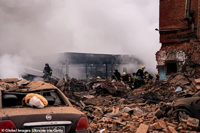 Firefighters remove debris after Russian missile attack on November 26, 2024 in Sumy, Ukraine