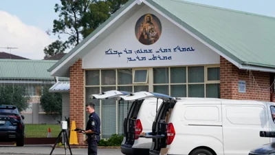 Tensions rise in Australia after a bishop and priest are wounded in a knife attack in a church