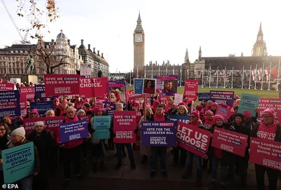 Activists supporting the Dignity in Dying campaign group protest on Parliament Square ahead of today's vote