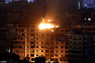 Smoke rises as a result of an Israeli airstrike in the southern suburb of Beirut on Friday