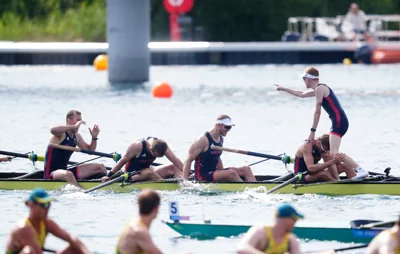 Cox Harry Brightmore celebrates standing in the boat after Team GB’s men’s eight success (Peter Byrne/PA)