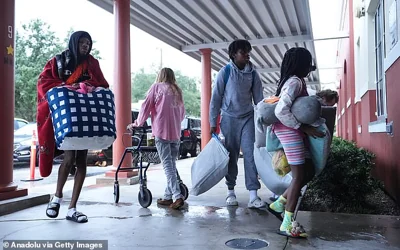 People spent the night at a school with their pets, sleeping on air mattresses