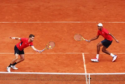 Austin Krajicek and Rajeev Ram compete for gold in the Tennis Men's Doubles match against Team Australia at the Olympic Games Paris 2024 at Roland Garros on August 03, 2024 in Paris, France.