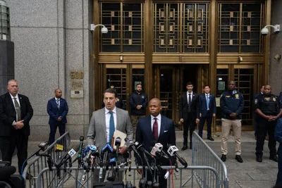 Mayor Eric Adams and his lawyer, Alex Spiro, address reporters outside the courthouse.