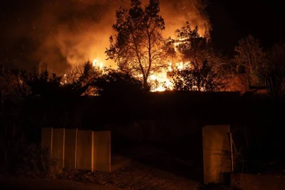 A house burns during a wildfire in Varnavas, north of Athens, on August 11, 2024. AFP PHOTO