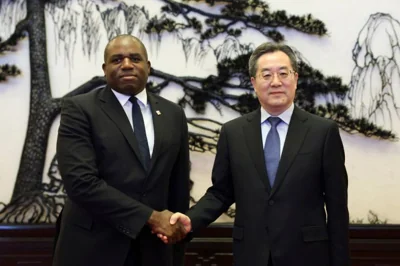 Britain's Foreign Secretary David Lammy and Chinese Vice Premier Ding Xuexiang