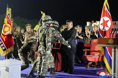 This picture taken on August 4, 2024 and released by North Korea's official Korean Central News Agency (KCNA) via KNS on August 5 shows North Korean leader Kim Jong Un (C) attending a ceremony for transferring new-type tactical ballistic missile launchers to the frontier military units, in Pyongyang. AFP PHOTO/KCNA VIA KNS