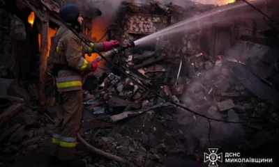 A firefighter works at the site of a residential house hit by a Russian drone strike in Mykolaiv, Ukraine, 17 November 2024.