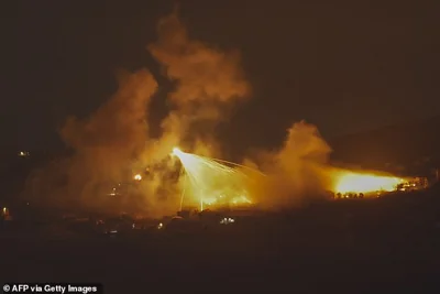 A picture taken from northern Israel, along the border with southern Lebanon, shows a fire following Israeli bombardment on an area of south Lebanon