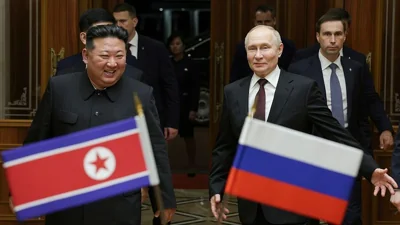 President Putin and North Korea's leader Kim Jong Un smile during their meeting at the Pyongyang Sunan International Airport, North Korea.