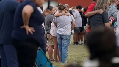 People attend a vigil at Jug Tavern Park following a shooting at Apalachee High School