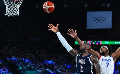 USA’s LeBron James lays up a ball past France’s Guerschon Yabusele in the men’s gold medal basketball match during the Paris 2024 Olympic Games at the Bercy Arena in Paris on Aug. 10, 2024. AFP PHOTO