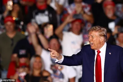 Republican presidential nominee and former U.S. president Donald Trump gestures during a rally at the site of the July assassination attempt against him, in Butler, Pennsylvania, U.S., October 5, 2024