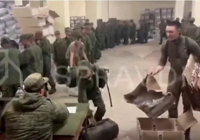 A captured image of video released by the Centre for Strategic Communication and Information Security of Ukraine (SPRAVDI) shows soldiers, presumed to be from North Korea, lining up to receive Russian supplies. Captured from SPRAVDI's X account 